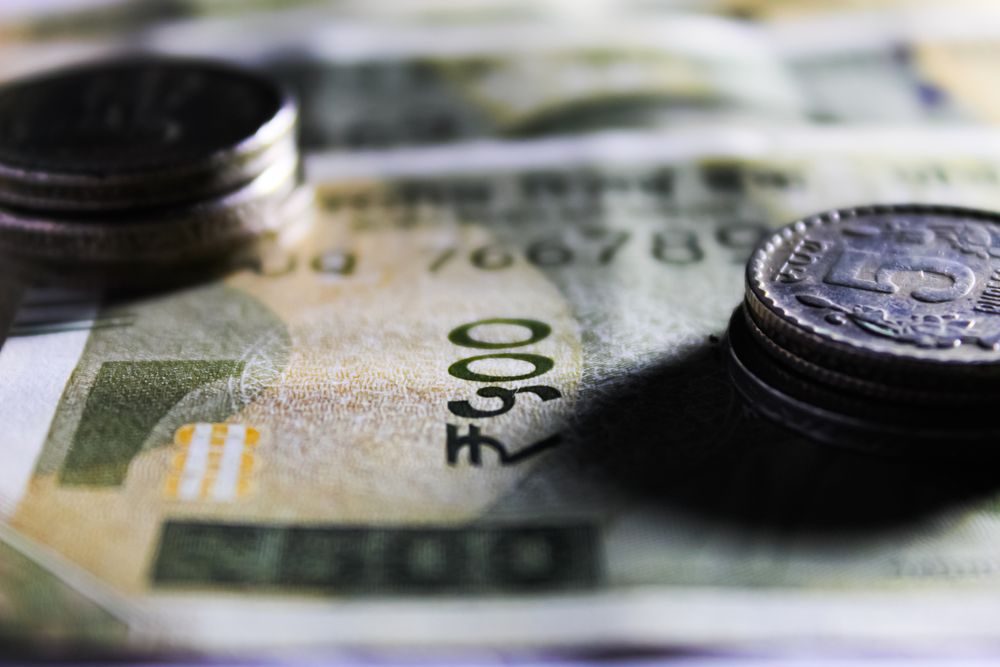 Close-up of Indian rupee banknotes and coins